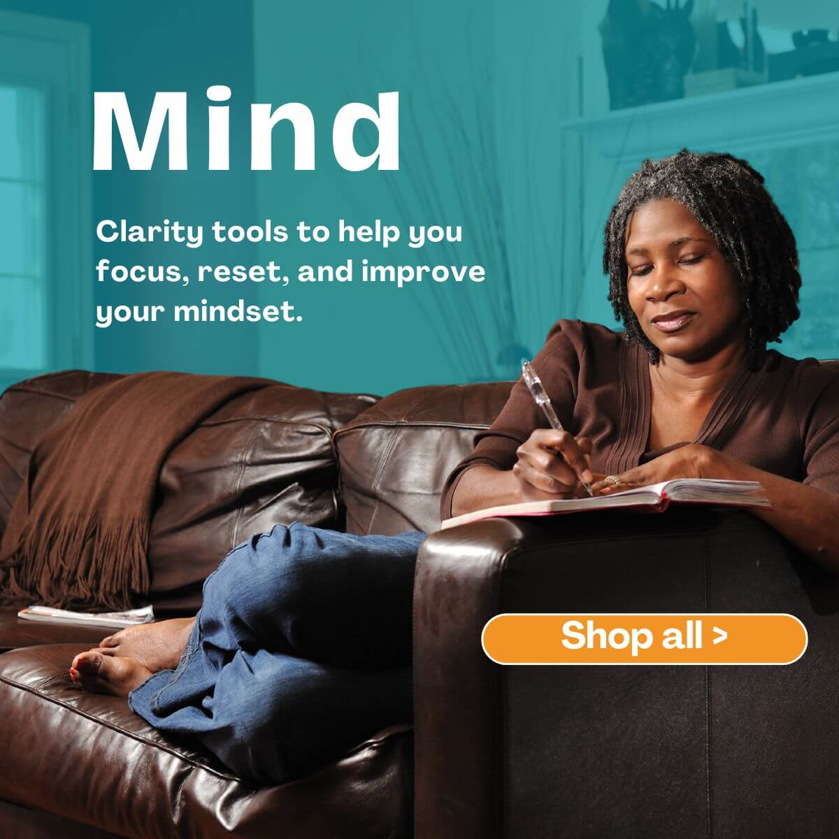 Woman on couch writing in journal with words Mind Clarity tools to help you focus, reset, and improve your mindset.